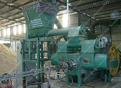 The sawdust briquette plant with log briquette maker in workshop