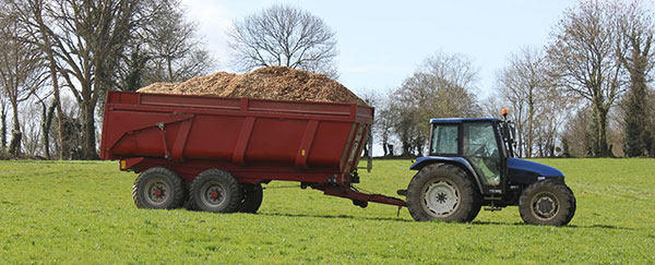 wood sawdust is taken by a tractor for drying